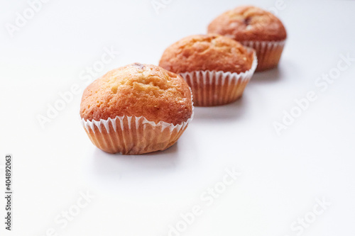 Three muffins isolated on a white background