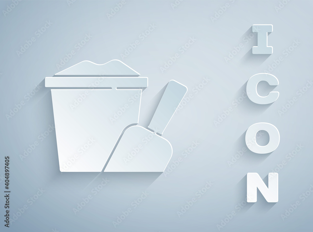 Paper cut Sand in bucket with shovel icon isolated on grey background. Plastic kid toy. Summer icon. Paper art style. Vector. Paper cut Sand in bucket with shovel icon isolated on grey background. Plastic kid toy. Summer icon. Paper art style. Vector.