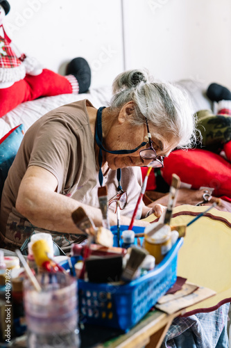 elderly lady working on crafts