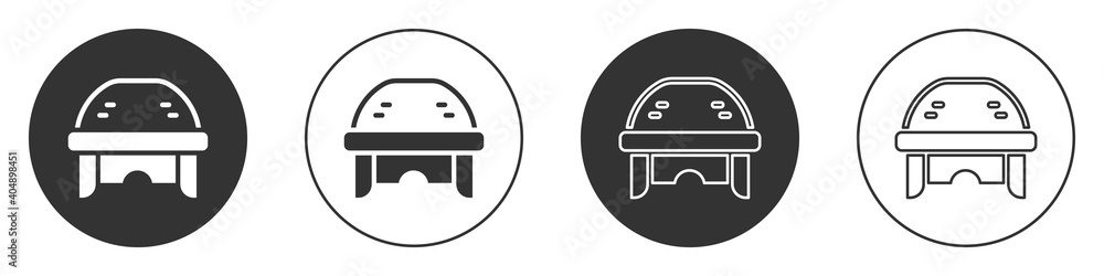 Black Hockey helmet icon isolated on white background. Circle button. Vector. Black Hockey helmet icon isolated on white background. Circle button. Vector.