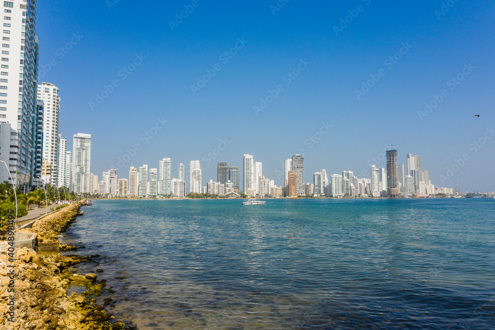 Obraz premium City public beach near Modern skyscrapers business apartments hotels in Cartagena Colombia aerial view.
