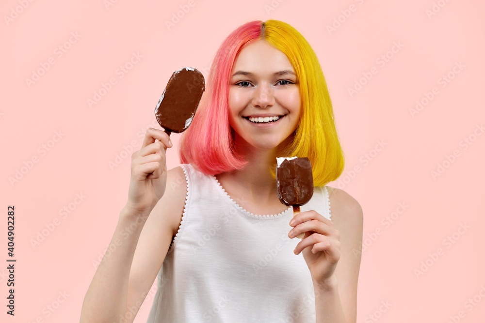 Beautiful smiling teenager girl with delicious chocolate ice cream on pink background Beautiful smiling teenager girl with delicious chocolate ice cream on pink background
