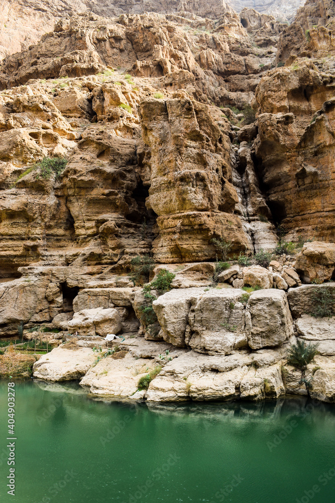 Green water lagoon and the rocks in Wadi Shab, Oman.