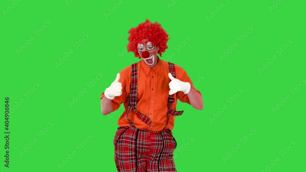 Happy clown show thumbs up while walking on a Green Screen, Chroma Key. Happy clown show thumbs up while walking on a Green Screen, Chroma Key.