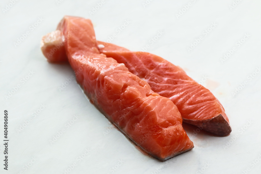 Composition with fresh salmon on light background Composition with fresh salmon on light background