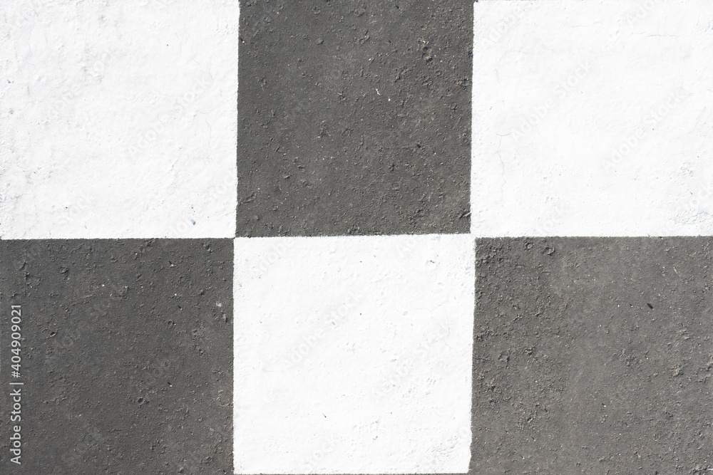 Fototapeta premium Asphalt painted in a checkerboard pattern, road marking, top view