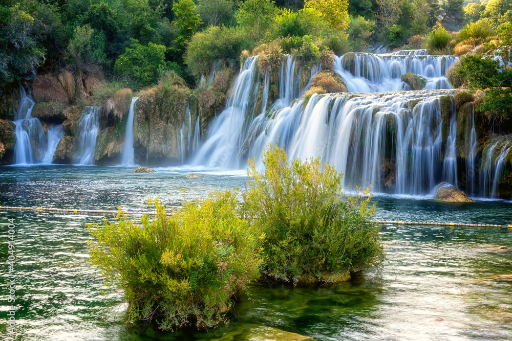 Fototapeta premium Amazing nature landscape, beautiful waterfall at sunrise, famous Skradinski buk, one of the most beautiful waterfalls in Europe and the biggest in Croatia, outdoor travel background