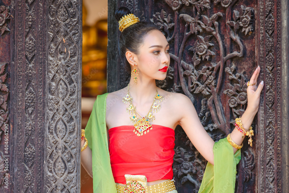 Luxury portrait of a beautiful Thai girl in traditional thai red ...