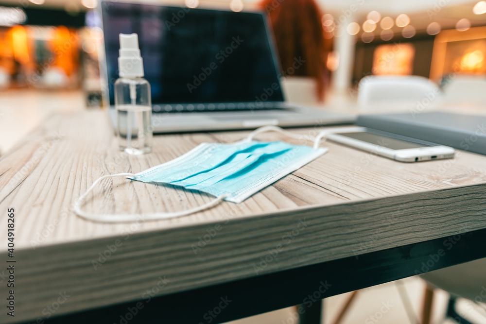 laptop and personal protective equipment on the table laptop and personal protective equipment on the table