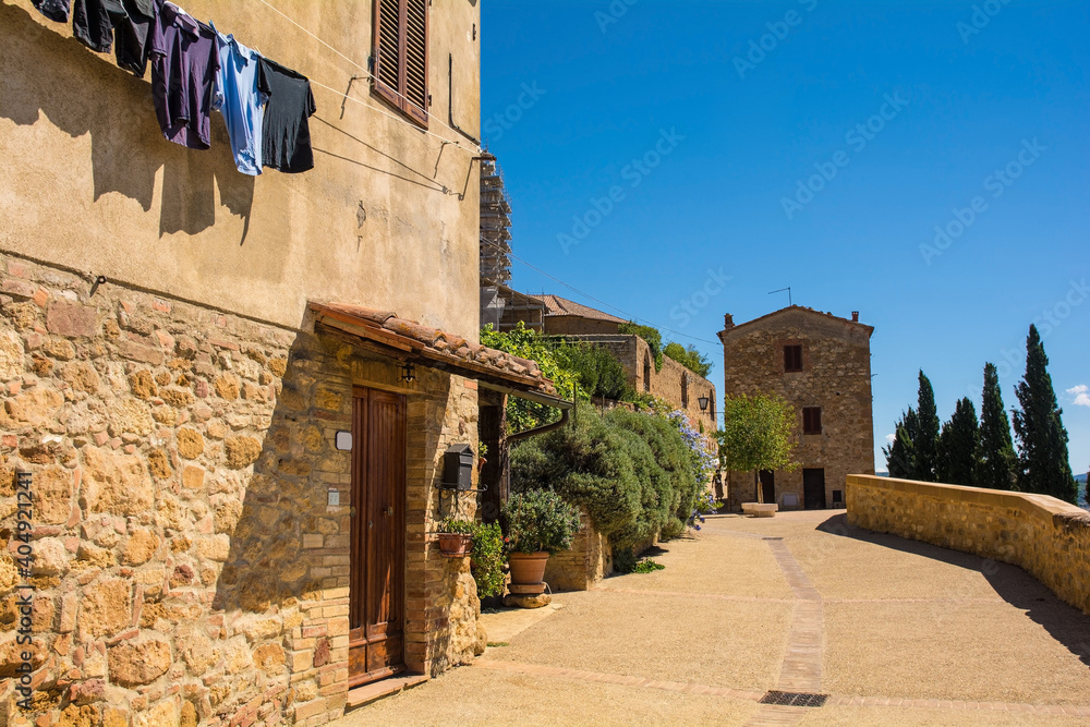 Historic stone buildings on the old walls of Pienza in Siena Province, Tuscany, Italy
