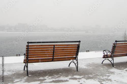 Bench on an empty city embankment, copy space for text
