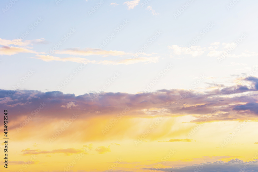 Blue-orange sky at sunset with clouds, background