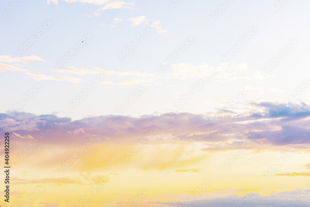 Blue-orange sky at sunrise with clouds, background