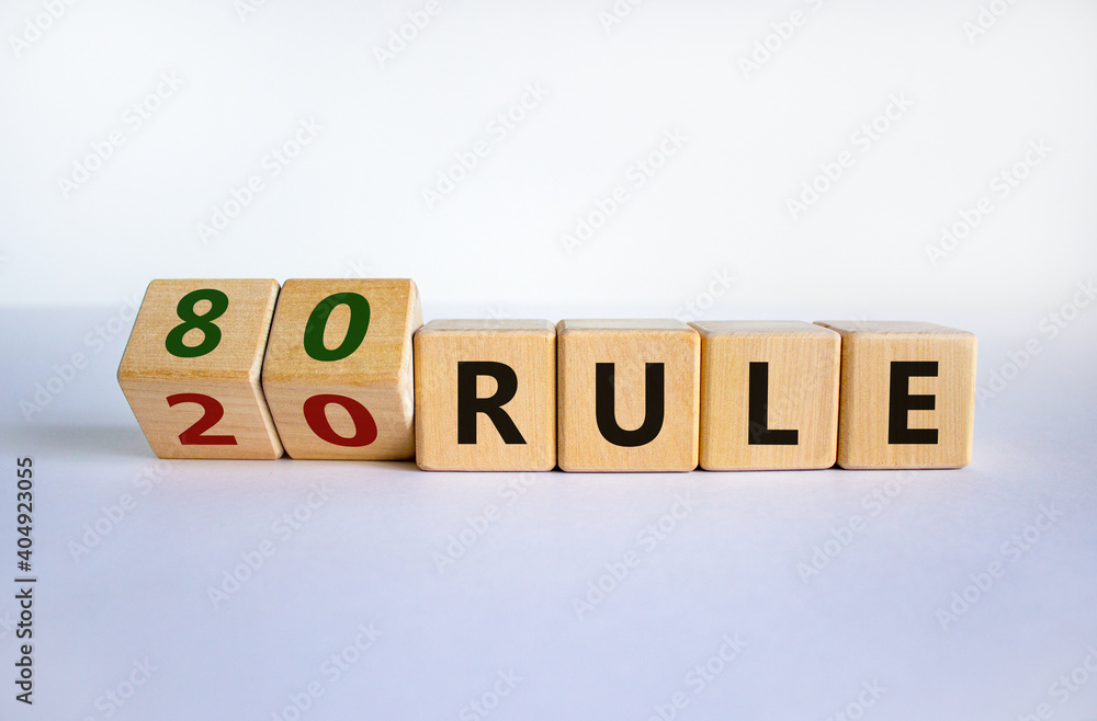 80 on 20 rule symbol. Pareto principle. Turned wooden cubes with words '80 on 20 rule'. Beautiful white background, copy space. Business and 80 on 20 rule, pareto principle concept. 80 on 20 rule symbol. Pareto principle. Turned wooden cubes with words '80 on 20 rule'. Beautiful white background, copy space. Business and 80 on 20 rule, pareto principle concept.