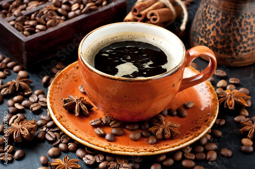 Mug with coffee on dark background © amberto4ka