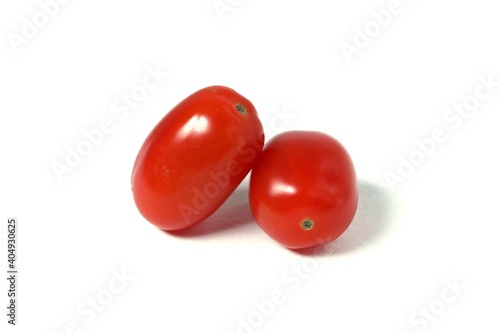 Cherry tomatoes on an isolated white background.