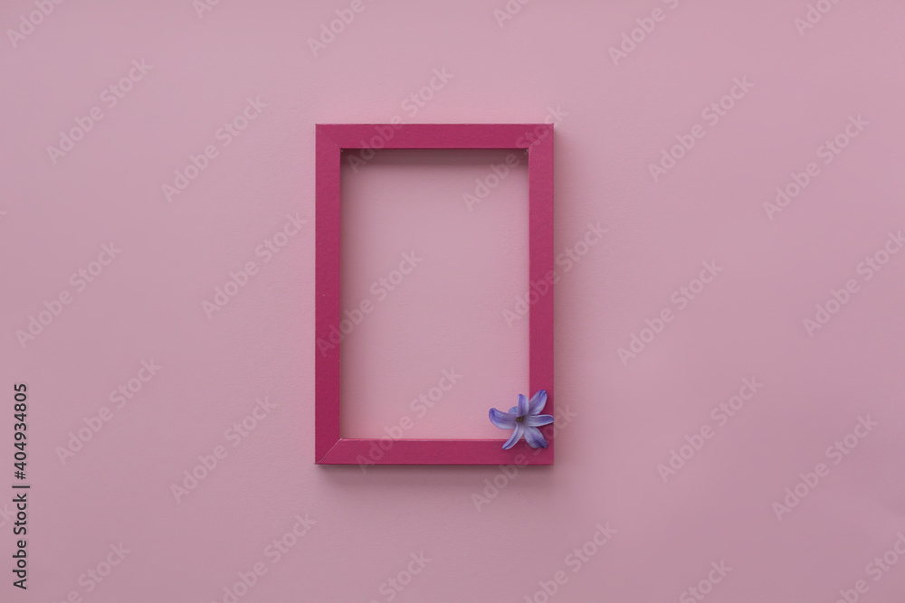 Pink photo frame and lilac hyacinth on a pink background. Pink photo frame and lilac hyacinth on a pink background.