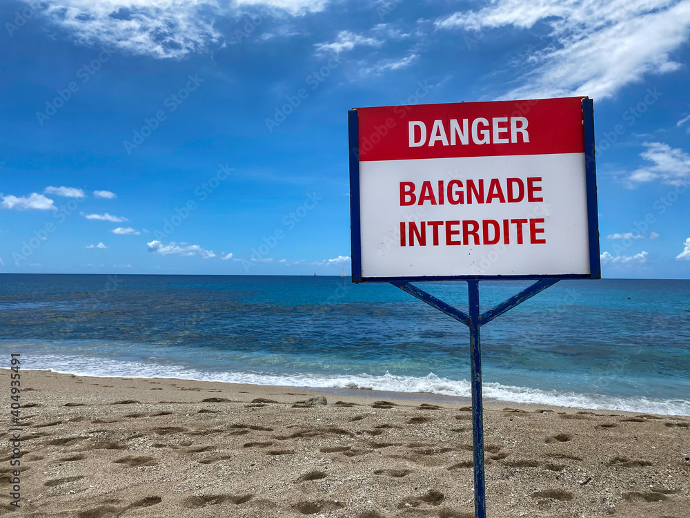 Danger sign, swimming is forbidden because of sharks in Reunion island