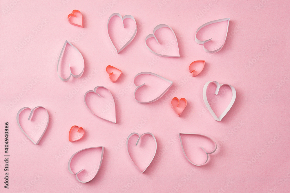 Paper hearts on a pink background. Valentine's day,background with hearts
