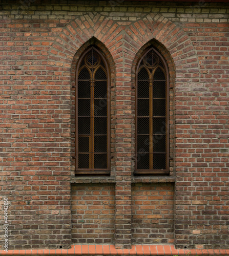 old brick wall with windows