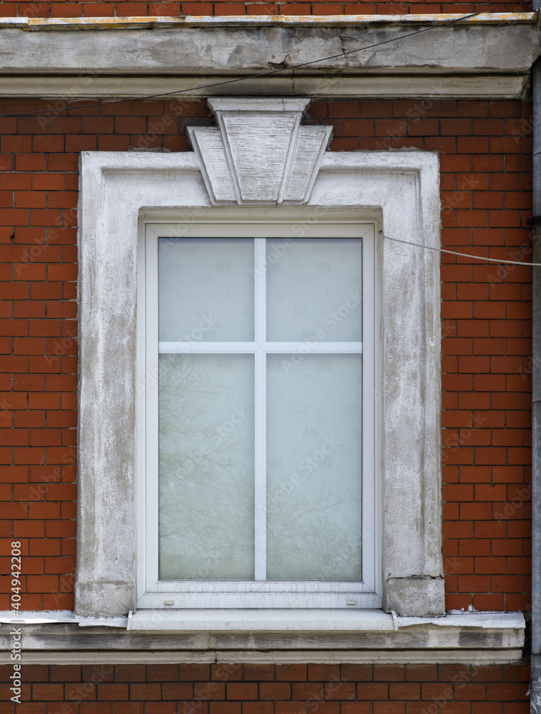 old window on a brick wall
