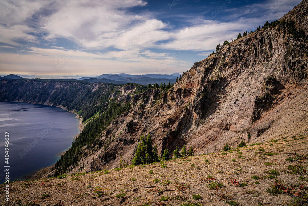 This is Crater Lake National Park in Oregon, captured at a viewpoint on the Rim Drive. This lake is a stunning blue-violet color.