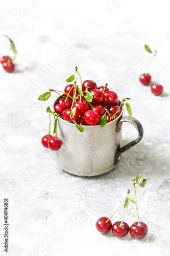 cherries in a bowl on the light background