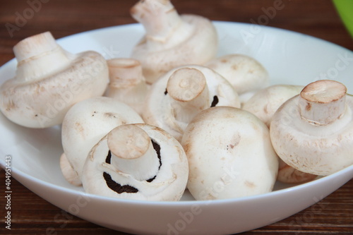 fresh champignons close-up on a wooden table Vegetarian food. Proper nutrition