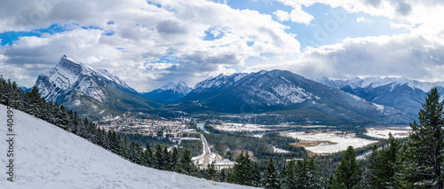 Overlook view Town of Banff in snowy winter season. Snow Capped Mount Rundle, Sulphur Mountain in background. View from Mount Norquay Banff View Point. Banff National Park, Canadian Rockies, Canada.