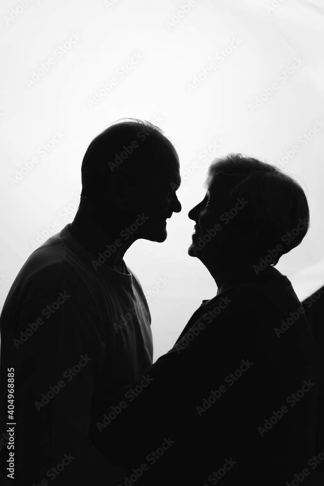 Elderly couple hugging in black and white colors. Happy loving caring people. Caucasian retired man and woman. valentines day