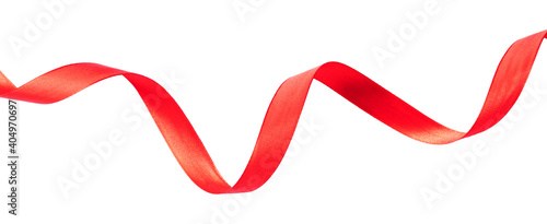 Delicate red wavy ribbon isolated on white background.