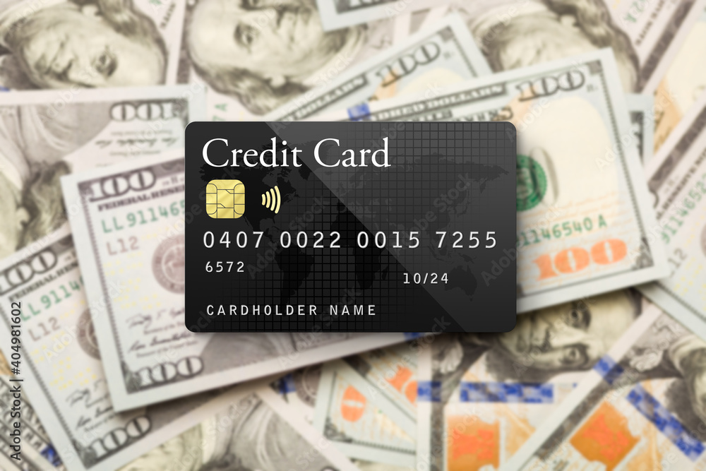 Fototapeta premium Mockup Black Credit Card Resting on One Hundred Dollar Bills Background