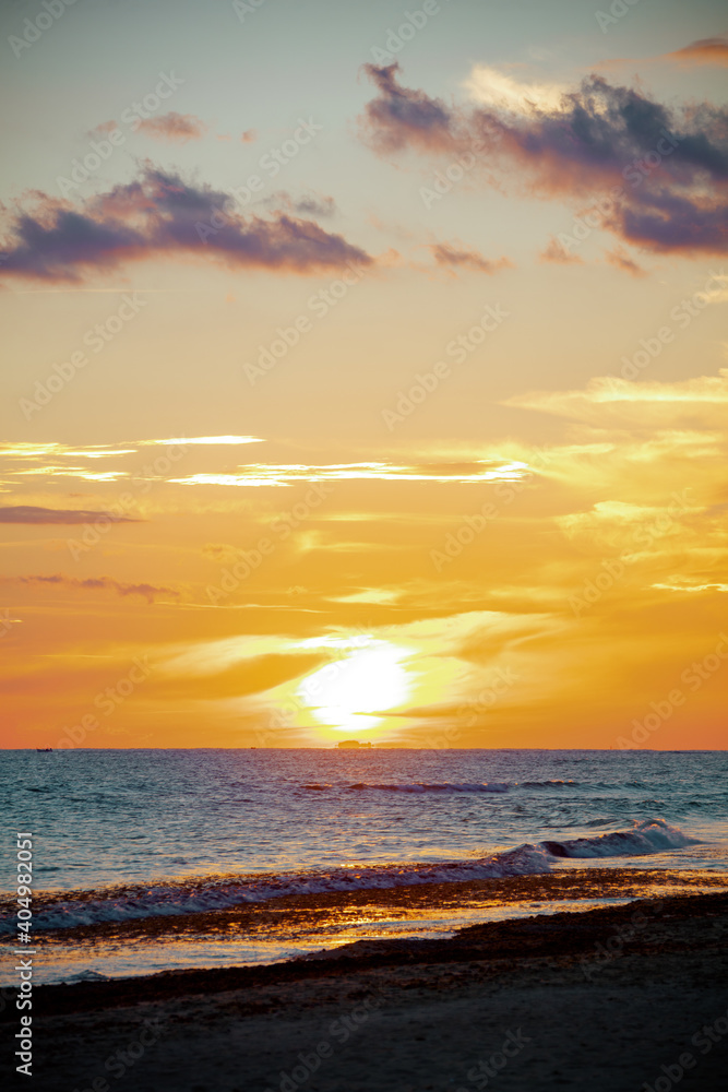 landscape with beach and clouds at sunset