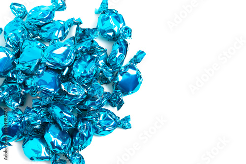 Pile of Blue Wrapped Candy Isolated on a White Background photo