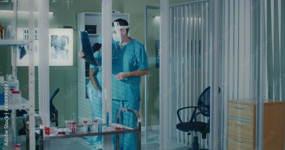 Doctor showing X ray to patient Doctor showing X ray to patient