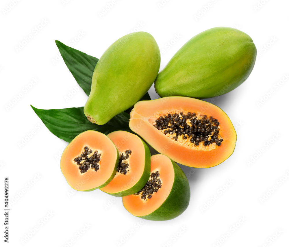 Fresh ripe papaya fruits with green leaves on white background Fresh ripe papaya fruits with green leaves on white background