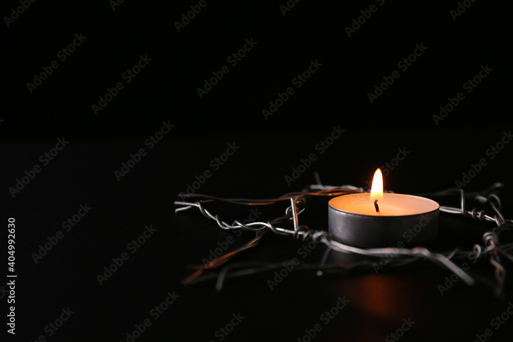 Ταπετσαρία Burning candle and star of David made with barbed wire on black background, space for text