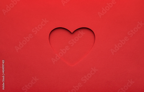Red heart cut from paper