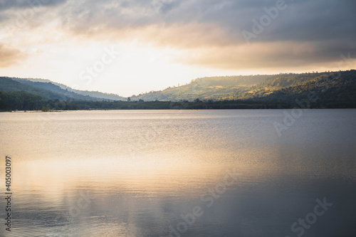 foggy lake with colorful sky  shining with sunlight. Beautiful lake view. Amazing sunset on a beautiful mountain lake.Beautiful scenery sunset sky view of lake and reflection in water.