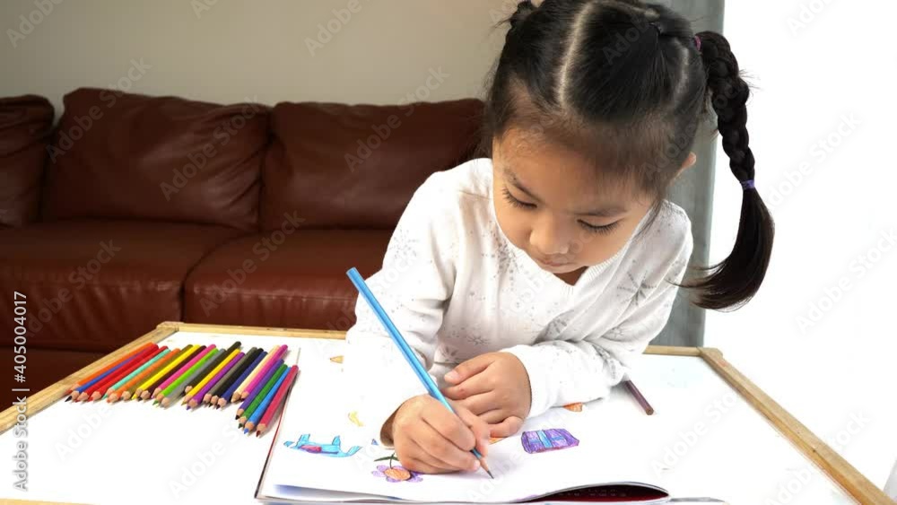 little child drawing with colored pencils little child drawing with colored pencils