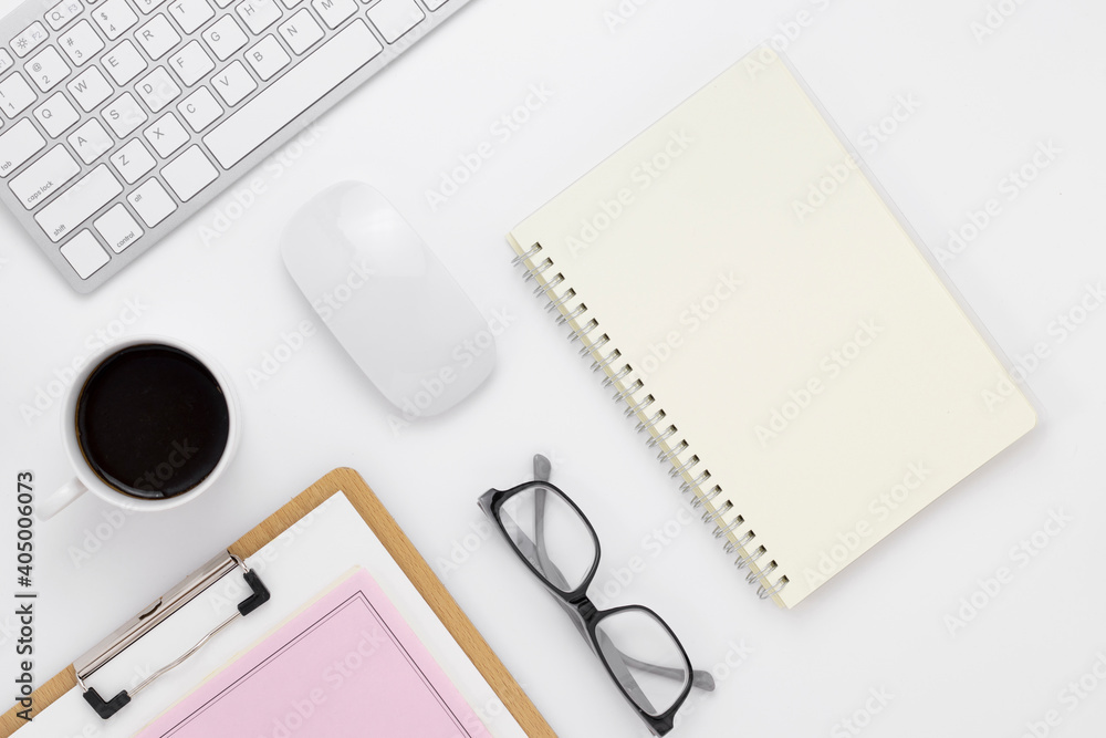 Minimal Office desk table top view with office supply and coffee cup on a white table with copy space, White color workplace composition, flat lay Minimal Office desk table top view with office supply and coffee cup on a white table with copy space, White color workplace composition, flat lay