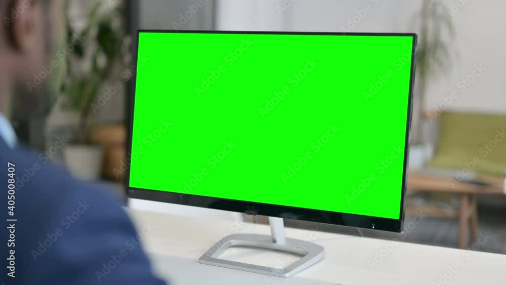 Businessman Working on Desktop with Green Chroma Key Screen Businessman Working on Desktop with Green Chroma Key Screen