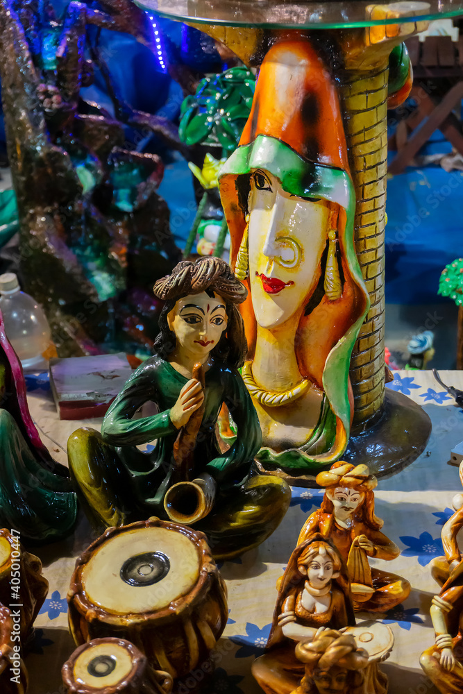 Colorful male and female Terracotta dolls dressed in traditional Indian dresses, made in Krishnanagar, Nadia, West Bengal, for sale in Handicraft Fair in Kolkata.