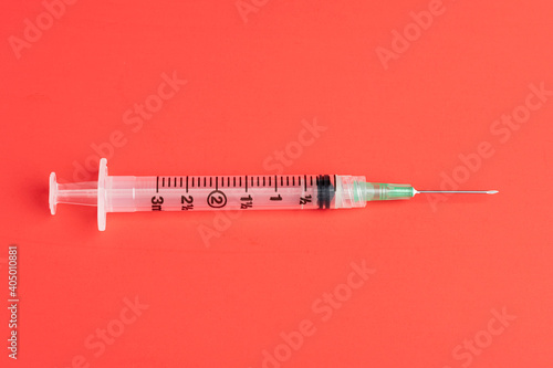 Hygienic Single-Use Disposable Injection On Red Background photo
