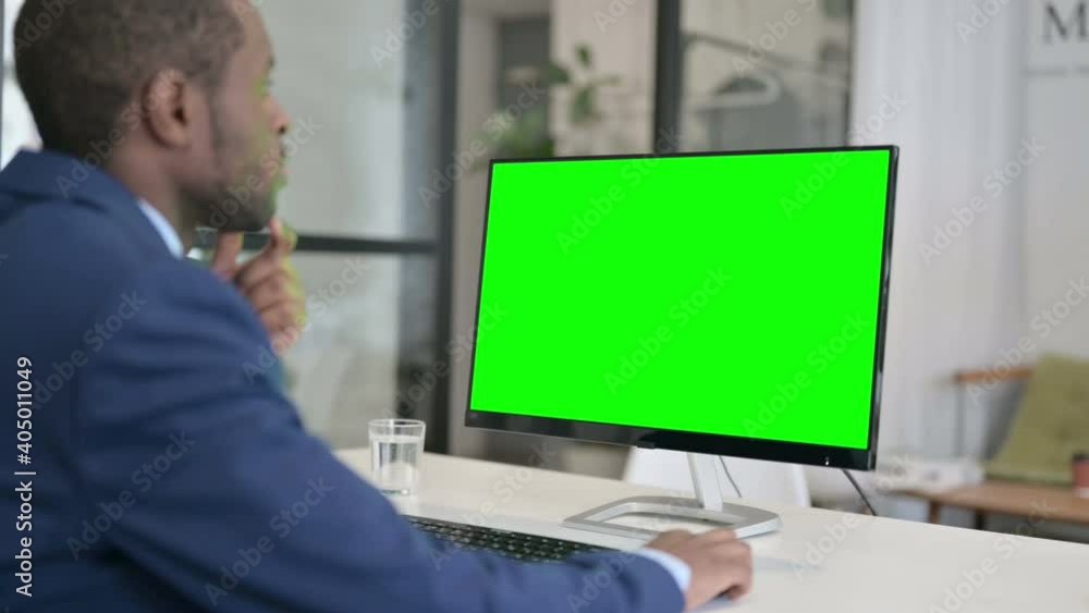 African Businessman Using Desktop with Green Chroma Key Screen African Businessman Using Desktop with Green Chroma Key Screen