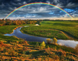 Landscape with a Rainbow on the River in Spring. colorful morning