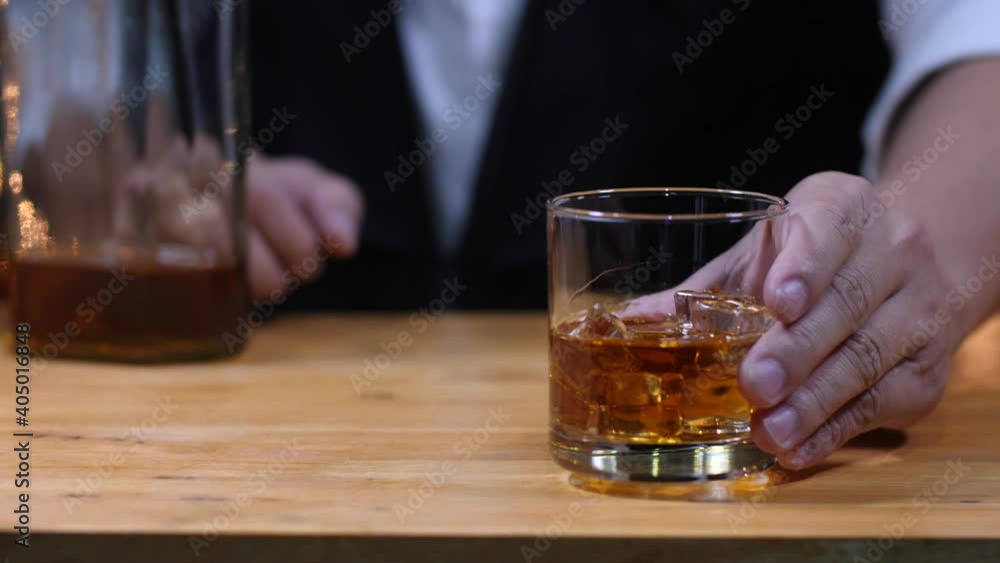 businessman holding whiskey, a restaurant businessman holding whiskey, a restaurant