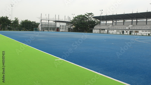 The hockey court with the blue floor looks very quiet in the afternoon