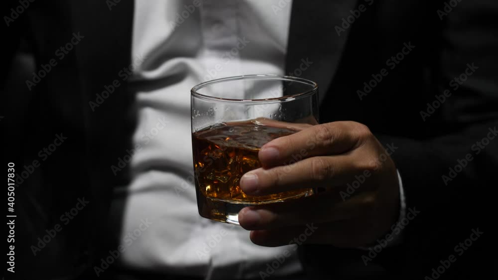 businessman holding whiskey, a restaurant businessman holding whiskey, a restaurant