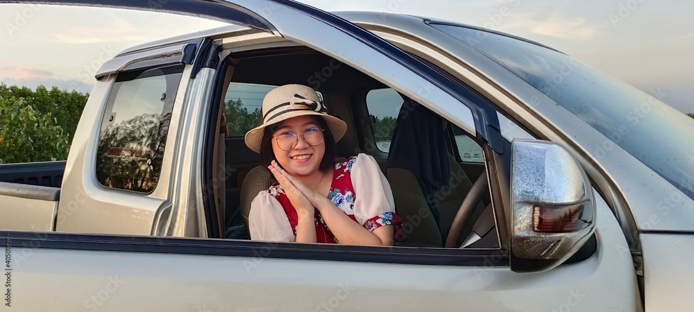 Naklejka premium Young woman enjoy life in car of holiday travel vacation.